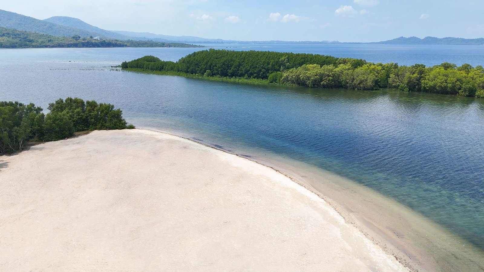 White sandbar and calm water
